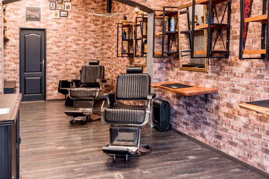 Vintage barber chairs by a shopfront window